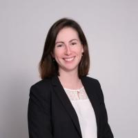 A woman in a smiling business suit