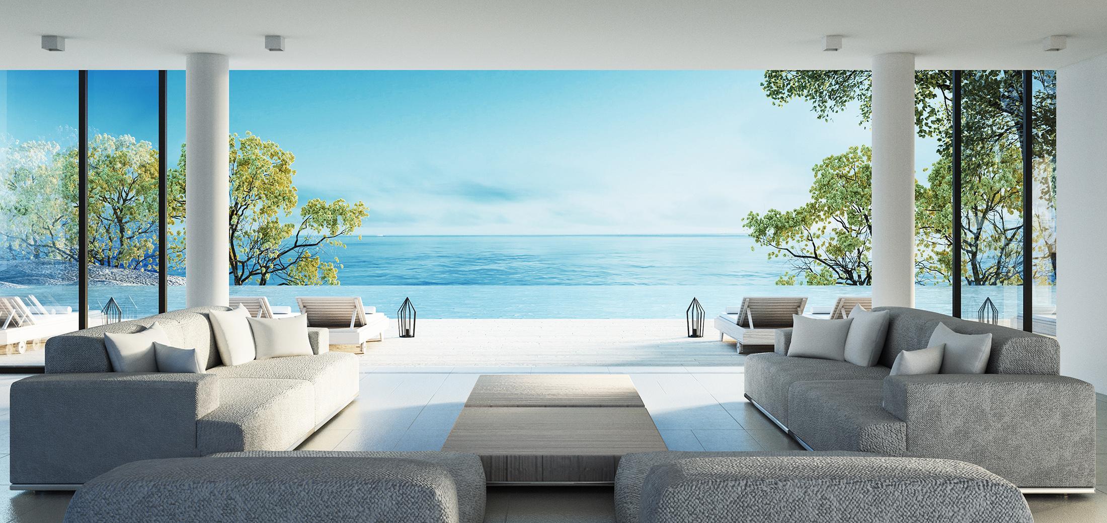 A living room with a view of the ocean