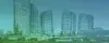 A group of skyscrapers with bright green lights.