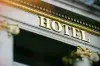 A hotel sign is displayed on the side of a building.