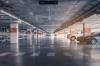 Underground parking with cars parked inside.